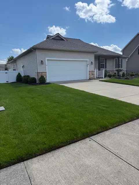 Healthy green lawn in Lorain, Ohio treated by Field of Dreams Lawn Care